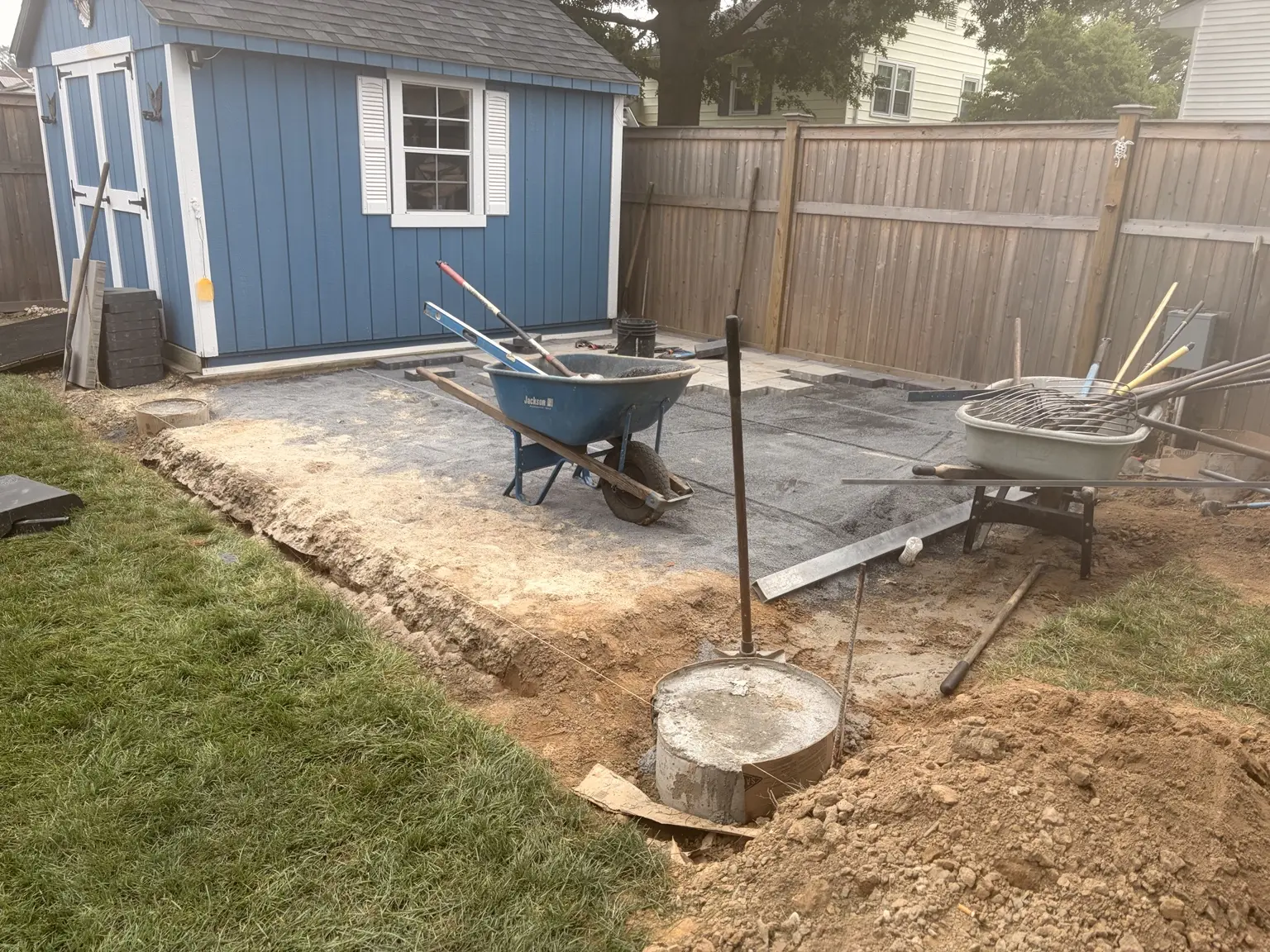 Prepared aggregate base during a paver patio installation in Hamilton, New Jersey