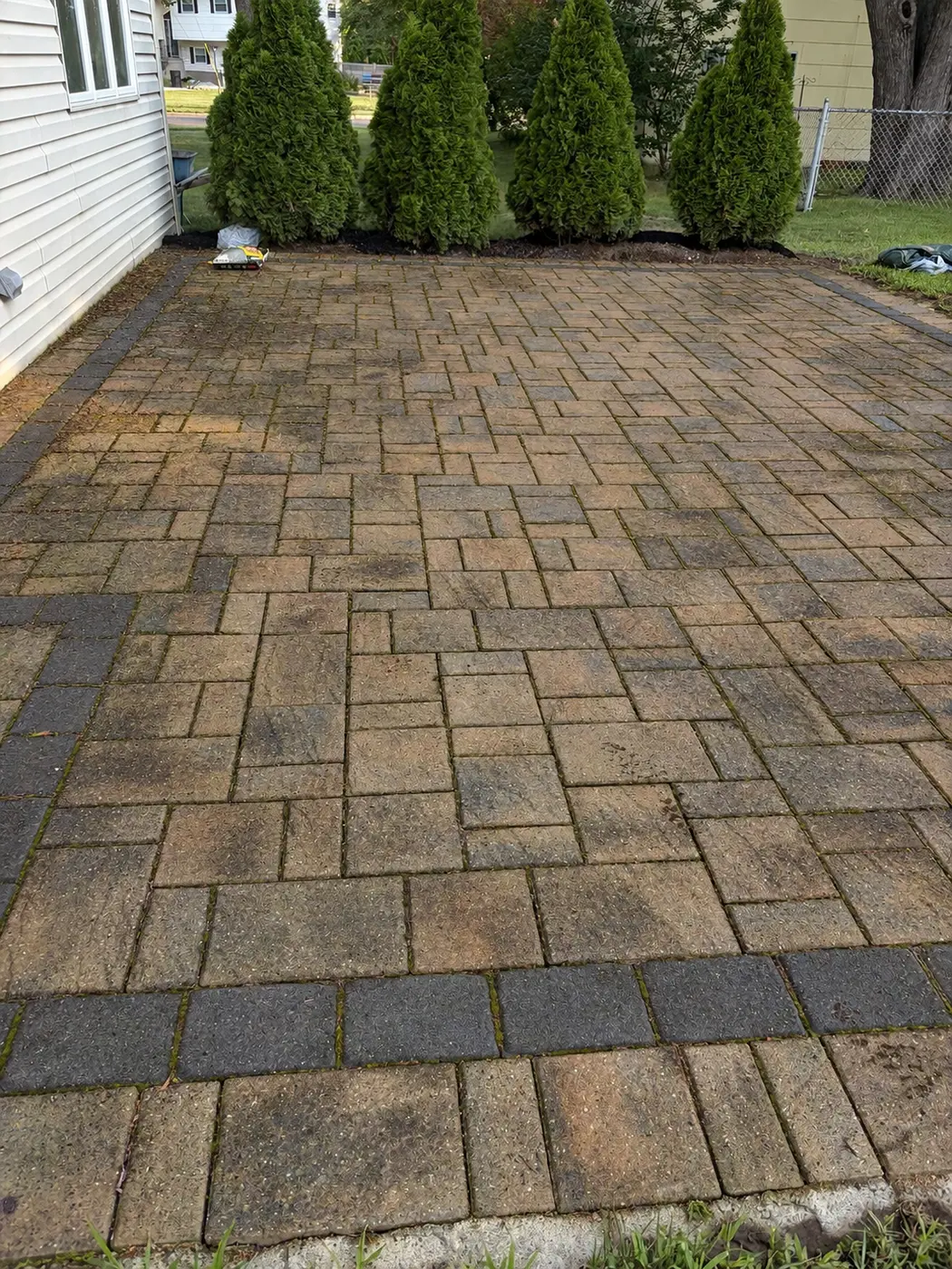 Dirty paver patio before professional washing
